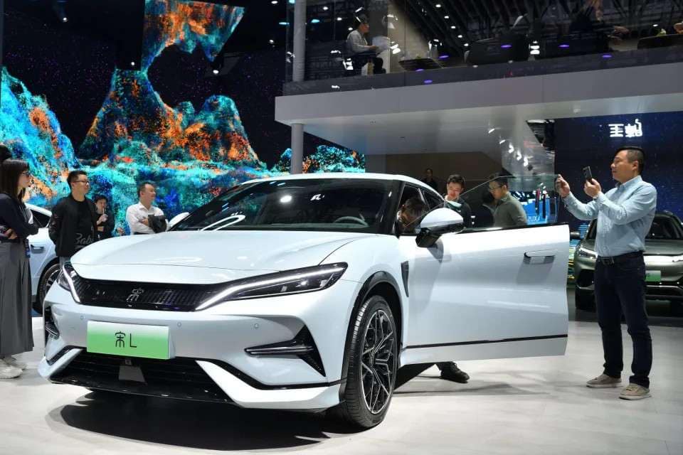 As China’s electric vehicle industry expands globally, traditional automakers emphasize the increasing significance of cost reduction over other priorities